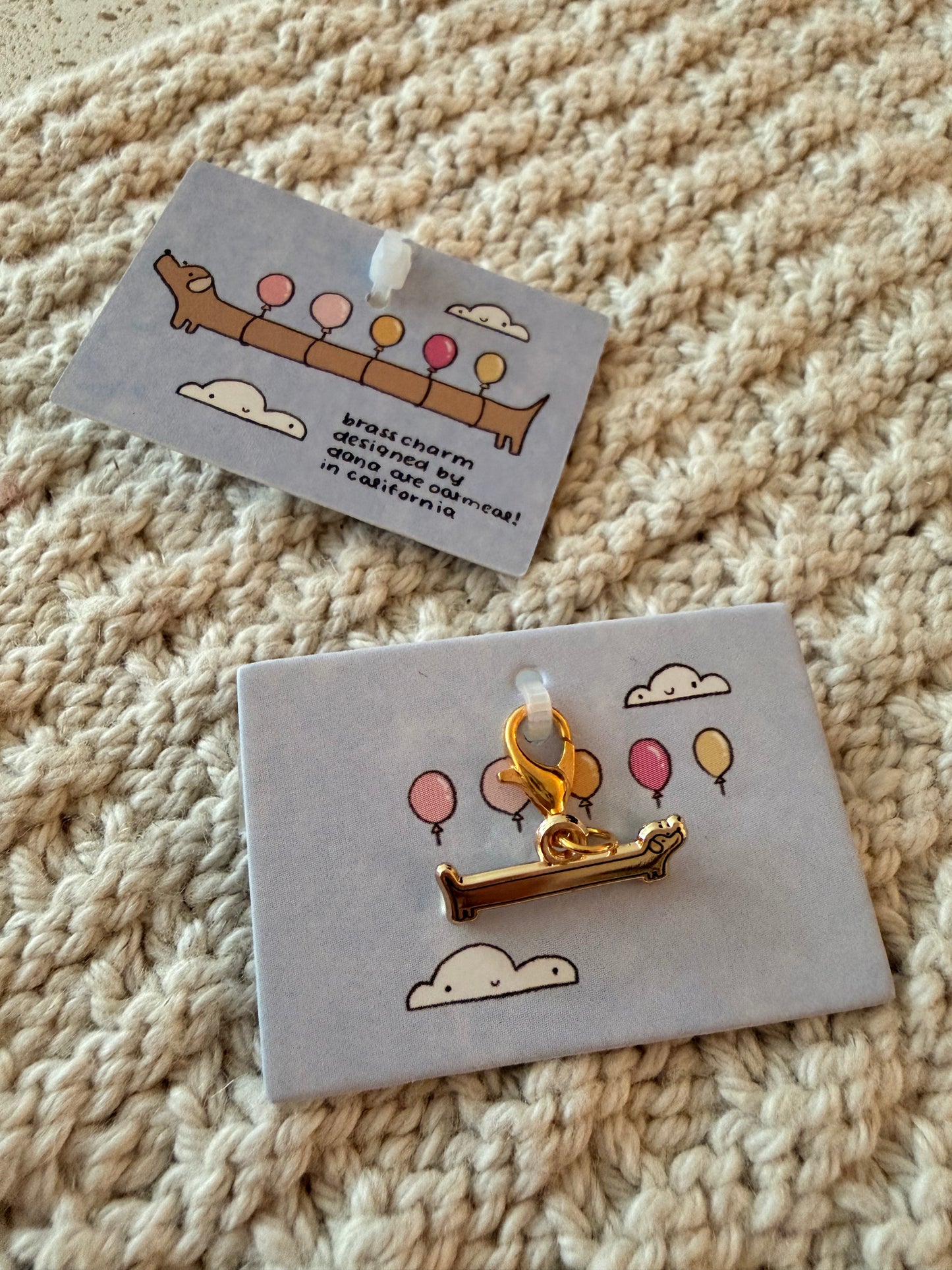 balloon dog brass charm